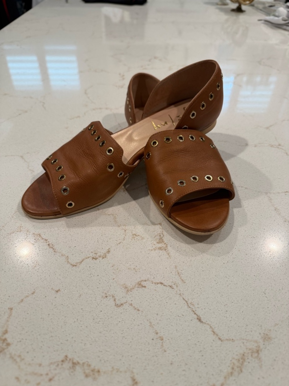 French Sole Brown Leather Open-Toe Grommet Flats